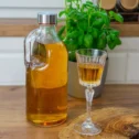 1-l-glass-bottle-with-cap-and-hand-631399_1